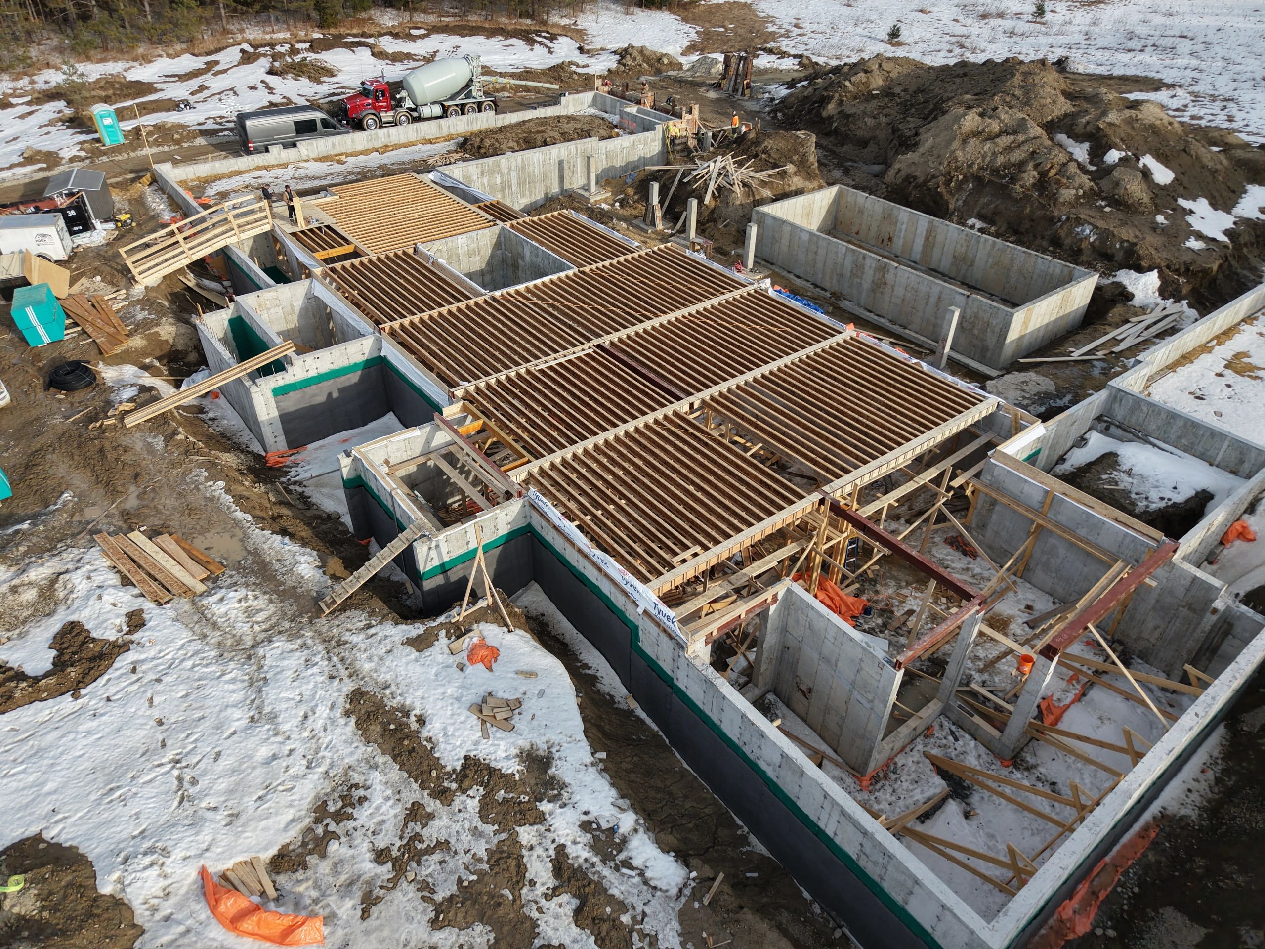 Residential construction site in snowy winter aerial view